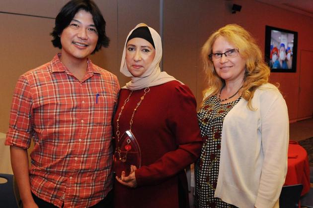 Three co-workers smile for a photo during Nurses Recognition Day