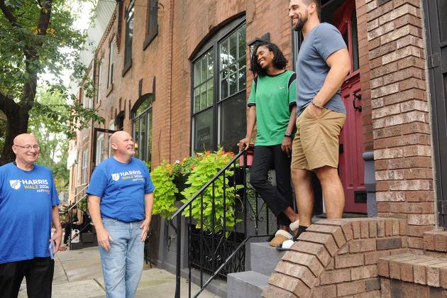 UFT President Michael Mulgrew (center) and AFT Pennsylvania President Arthur Steinberg (left) talk to Philadelphia teacher Luke Dugan and his partner Crishana Manigan as they campaign for the Harris-Walz ticket.
