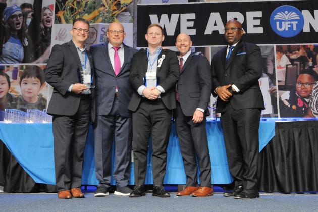 Backer/Sheintaub Award winners pose for a photo on the stage with union officials at the Midtown Hilton during Teacher Union Day on Nov. 3, 2024.