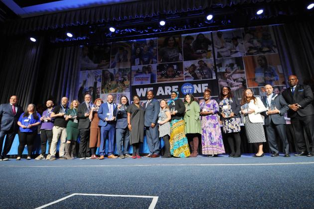 High School Ely Trachtenberg Awardees take the stage for a group photo at Teacher Union Day on Nov. 3, 2024 at the Midtown Hilton. 