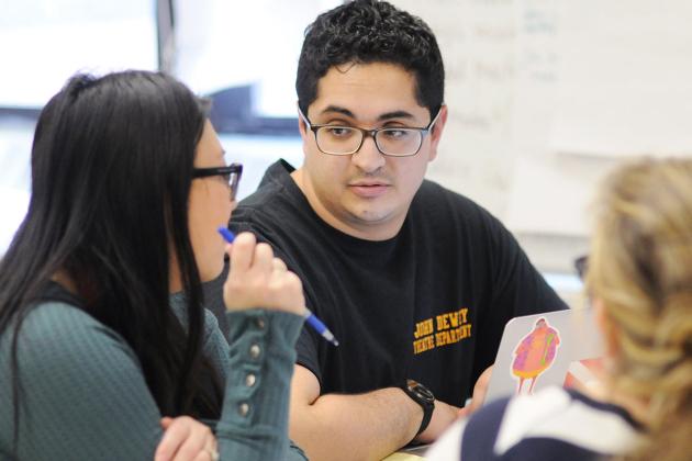 Two colleagues engage in a conversation.