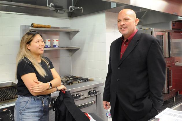 Mulgrew has a conversation in a class kitchen