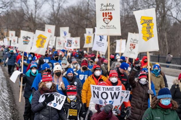 A group of people march in protest