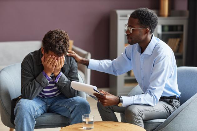 Teacher talking with student