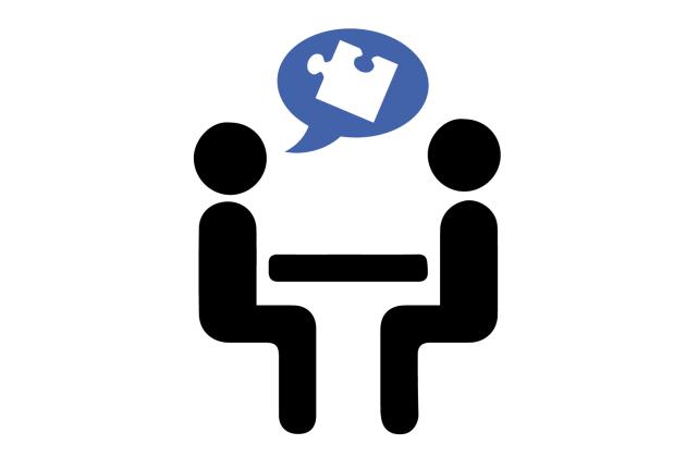 Two stick figures sitting at a table with puzzle thought bubble