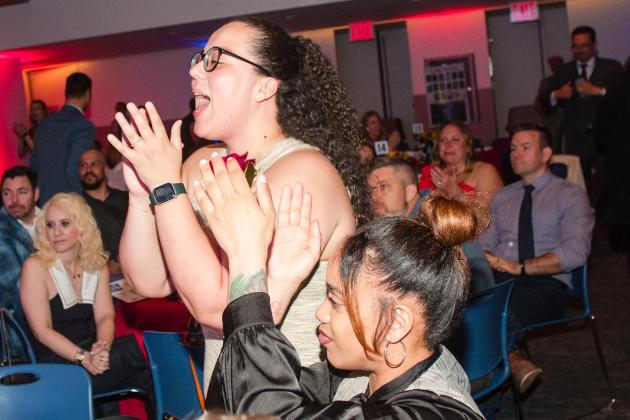 Two teachers cheer when their school is announced during the UFT Academic High School Awards on April 25, 2025. 