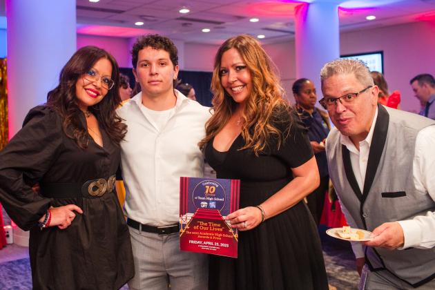A teacher from Queens Gateway to Health Sciences Secondary School, celebrates winning an Excellence in Education Award with her sister, son and husband at the UFT Academic High School Awards on April 25, 2025. 