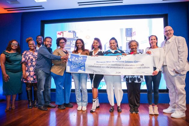 Beaming members from Brooklyn West Alternative Learning Center accept their Team High School Award.