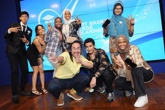 Group dynamically pose on stage