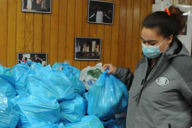 two women collect clothes