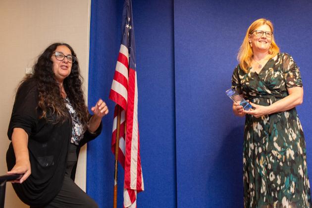 Debra Poulos (left), the director of the UFT Contract Empowerment Department, receives the Friend of the Chapter Award from UFT Speech Improvement Chapter Leader Caroline Murphy at the UFT Better Speech and Hearing Month Celebration on May 27, 2025.