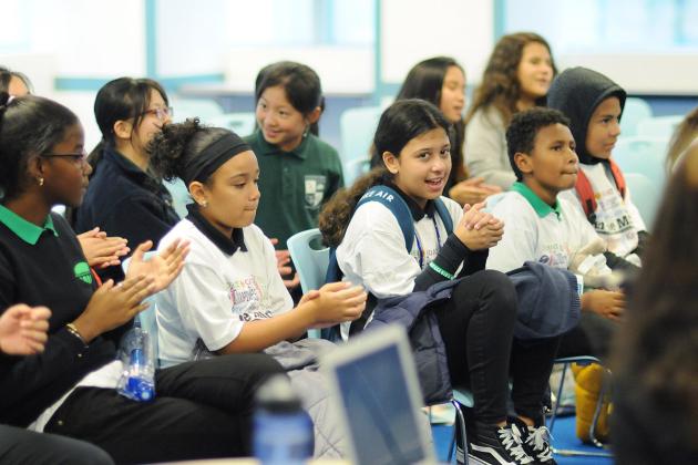 Group of students clapping