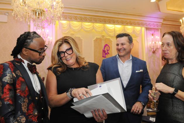 UFT District 11 Representative Dana Falciglia (second from left), greets guests as they arrive to the 2025 UFT District 11 Scholarship on March 28, 2025.