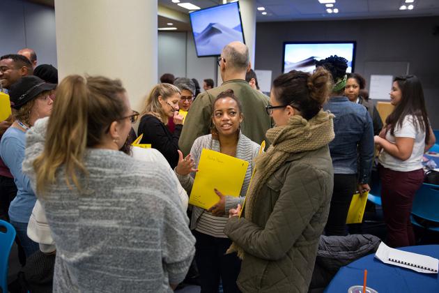 Ladies talking to each other in a crowded room
