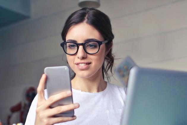 Teacher looking at phone