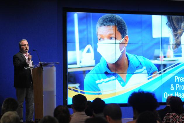 A man gives a presentation about healthcare