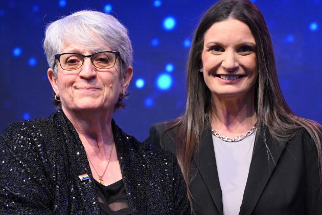 UFT District 79 Representative Patricia Crispino (left), standing next to NYSUT Executive Vice President Jaime Ciffone, receives top honors as the Sandy Feldman Outstanding Leadership Award-winner at the NYSUT RA.