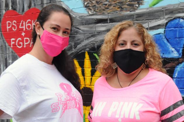  Chapter Leader Medina Selmanovic (left) and Principal Maria Guzman stand side by side for breast cancer awareness outside PS 46 in Brooklyn.