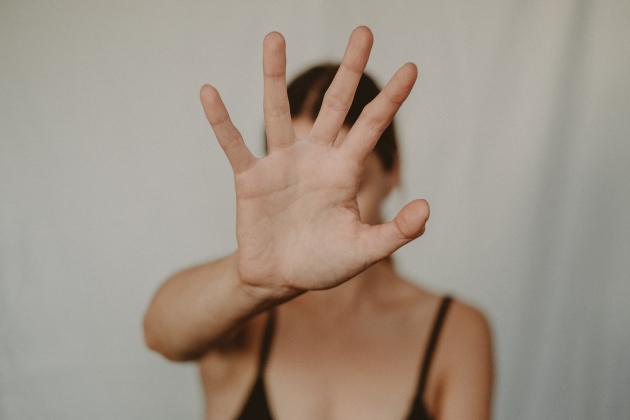 hand covering face