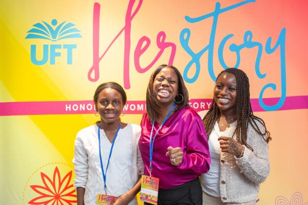 A woman takes a photo with her daughters at the UFT HERstory brunch on March 15, 2025. 