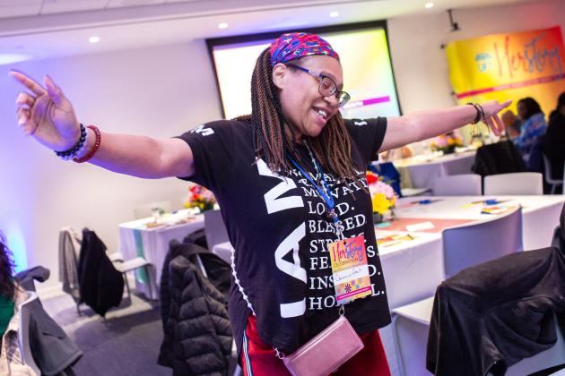 A UFT member in attendance is photographed while dancing at the HERstory brunch on March 15, 2025. 