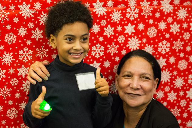 Smiling boy gives a thumbs up