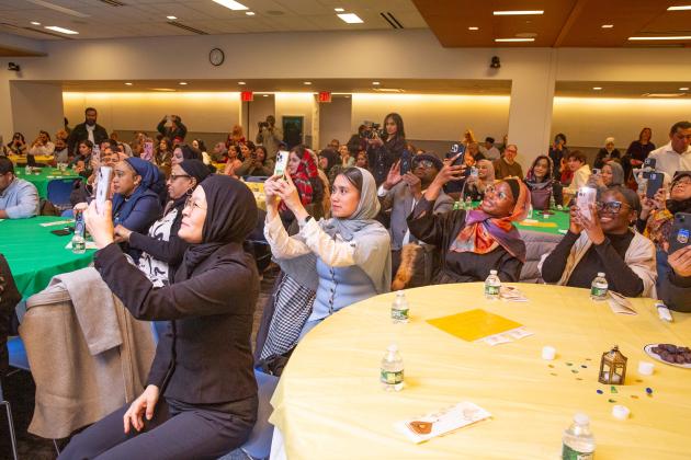 Members record and take photos during the mayor’s appearance at the UFT Muslim Educators Committee’s Iftar event.