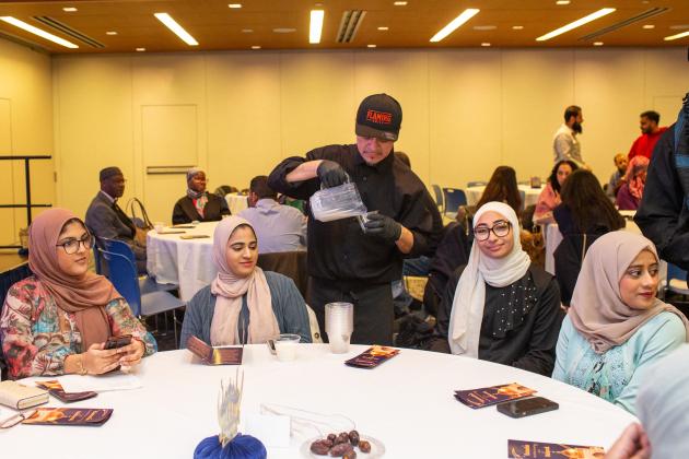 Guests are provided cups of milk, a drink that is traditionally served to break the Ramadan fast, along with water and dates at the UFT Muslim Educators Committee Iftar Dinner on March 7, 2025. 