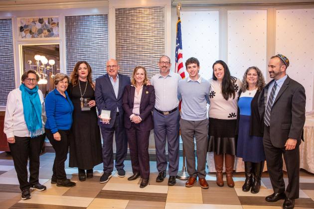 Honorees and special guests in attendance take a group photo at the UFT Jewish Heritage Committee Tikkun Olam Awards Dinner on Dec. 5, 2024. 