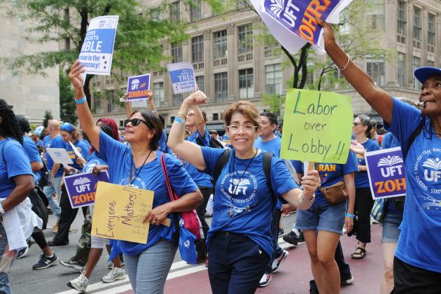 Lisette Morales Lugo (center), a bilingual school psychologist at Fannie Lou Hamer Freedom HS in the Bronx, marches alongside fellow UFT members up Fifth Avenue during the Labor Parade.