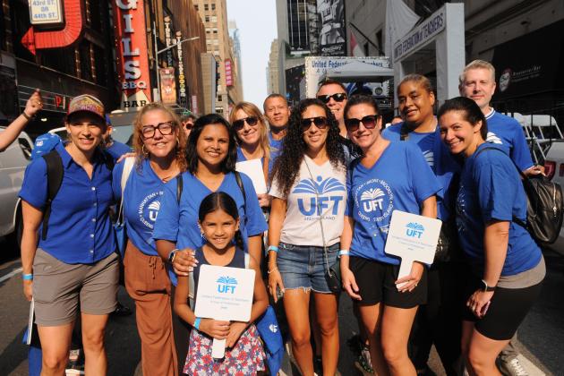 UFT Teacher Center coaches, staffers and their guests get together for a photo in the UFT staging area near the start of the 2025 NYC Labor Parade.