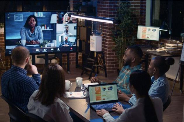 Students in classroom looking at a monitor