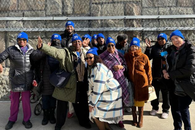Manhattan parents are greeted by UFT Political Director Vanecia Wilson (front, crouching) when they arrive in Albany for Lobby Day on March 10, 2025.