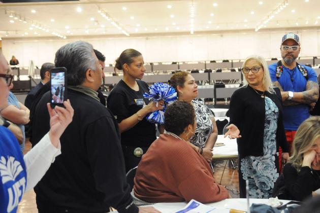 Members from Districts 14 and 32 in Brooklyn discuss fixing Tier 6 and other issues as they meet with state Assembly Member Maritza Davila (standing, right).