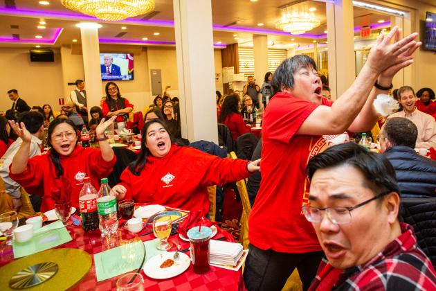 A woman reaches to catch lettuce thrown into the crowd at the UFT Asian Heritage Committee Lunar New Year Banquet on Feb. 28, 2025. 