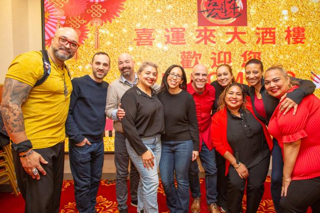 UFT members from District 32 smile for the camera at the UFT Asian Heritage Committee Lunar New Year Banquet on Feb. 28, 2025. 