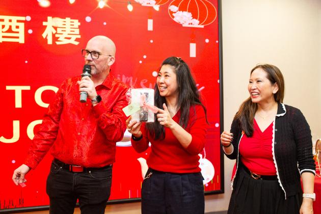 Teachers announce raffle winners at the UFT Asian Heritage Committee Lunar New Year Banquet on Feb. 28, 2025. 