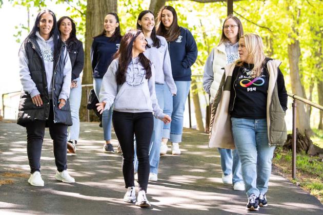 (Front row, from left) Teachers Janine Treglia and Jen Fabrizio lead colleagues on a lunchtime walk.