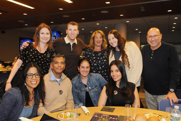Collaboration Award winner Spenser Scherling of IS 136 in Brooklyn’s Sunset Park celebrates with colleagues and family.