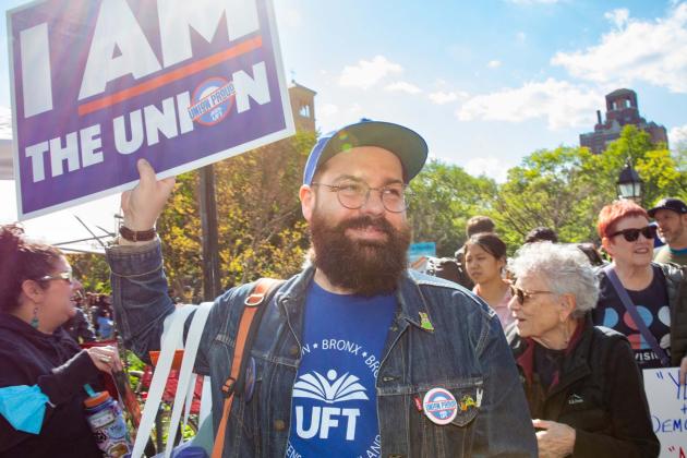 Paraprofessional Representative Jeremiah Bornemann of PS/IS 276 in Manhattan stands with fellow unionists to call for stronger labor rights at this year’s May Day rally.