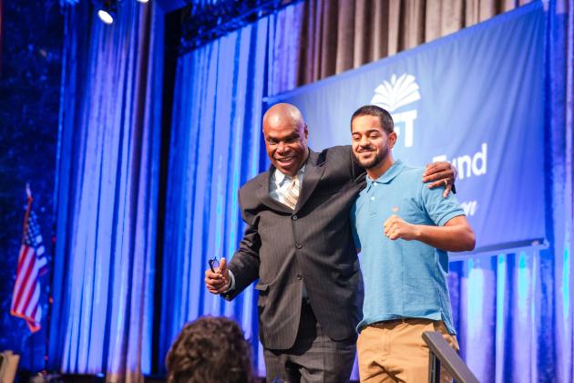 New retiree Jean Anglade takes a photo with Alonso Rivera, one of his former Central Park East HS math students, who was an American Sign Language interpreter at the UFT New Retiree Luncheon on Dec. 5, 2024.