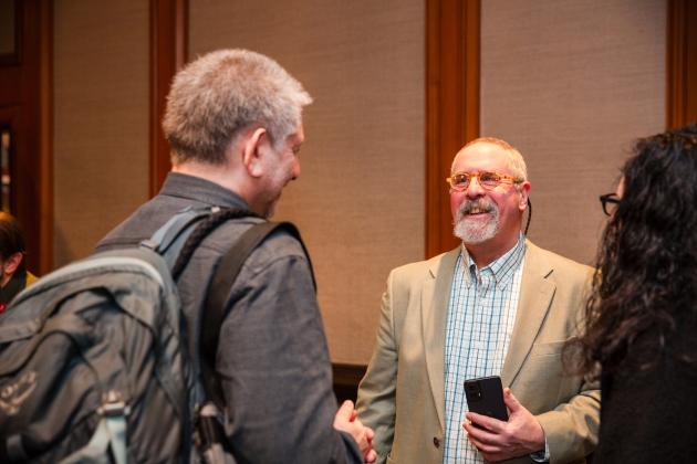 Retired Teachers Chapter Leader Bennett Fischer greets the retirees before the UFT New Retiree Luncheon at the Midtown Hilton on Dec. 5, 2024. 
