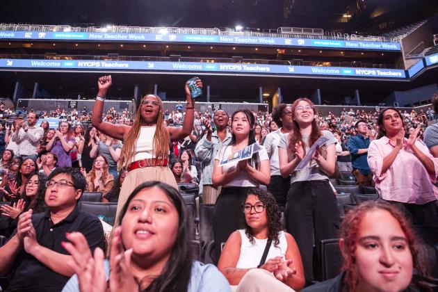 New teachers cheer in the stands at the Barclays Center.