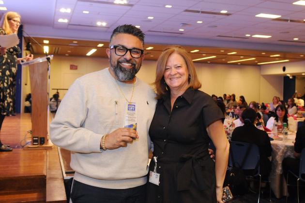  Gary Mehra, special education project manager, shows off his Friend of the Chapter award with UFT Vice President for Special Education MaryJo Ginese.