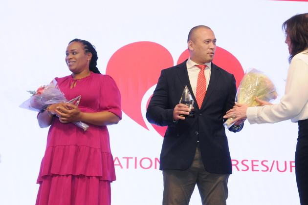 Susan Sappleton and Kaiser Mojica accept congratulations for winning Homecare Nurse of the Year at the Federation of Nurses/UFT Nurse Recognition Day celebration on May 8, 2025. 