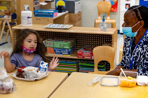 Student and Paraprofessional eating
