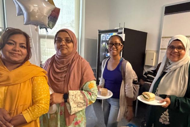 Paraprofessionals at an extended school year program sited at PS 176 in Queens gather for a UFT-sponsored lunch to celebrate their resolve to get weeks of back pay. 