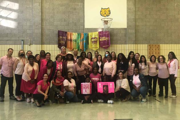 Teachers pose for Pink Day