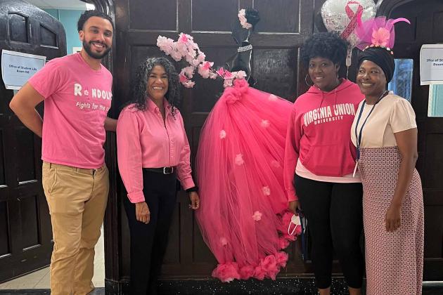 Teachers pose for Pink Day