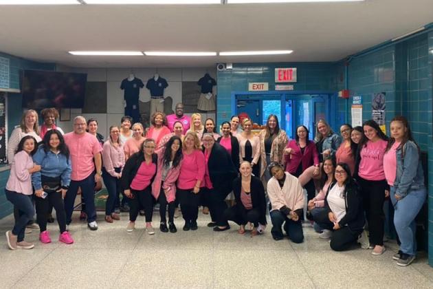Teachers pose for Pink Day